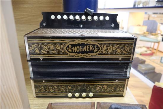 A Hohner Melodian Accordian and booklet